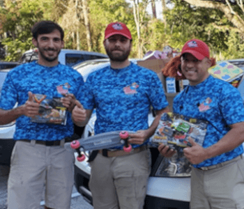 men holding prizes they won